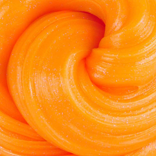 Close up detail of orange glow-in-the-dark putty.