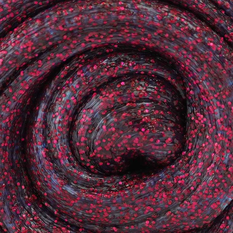 Close up detail of red glitter putty.